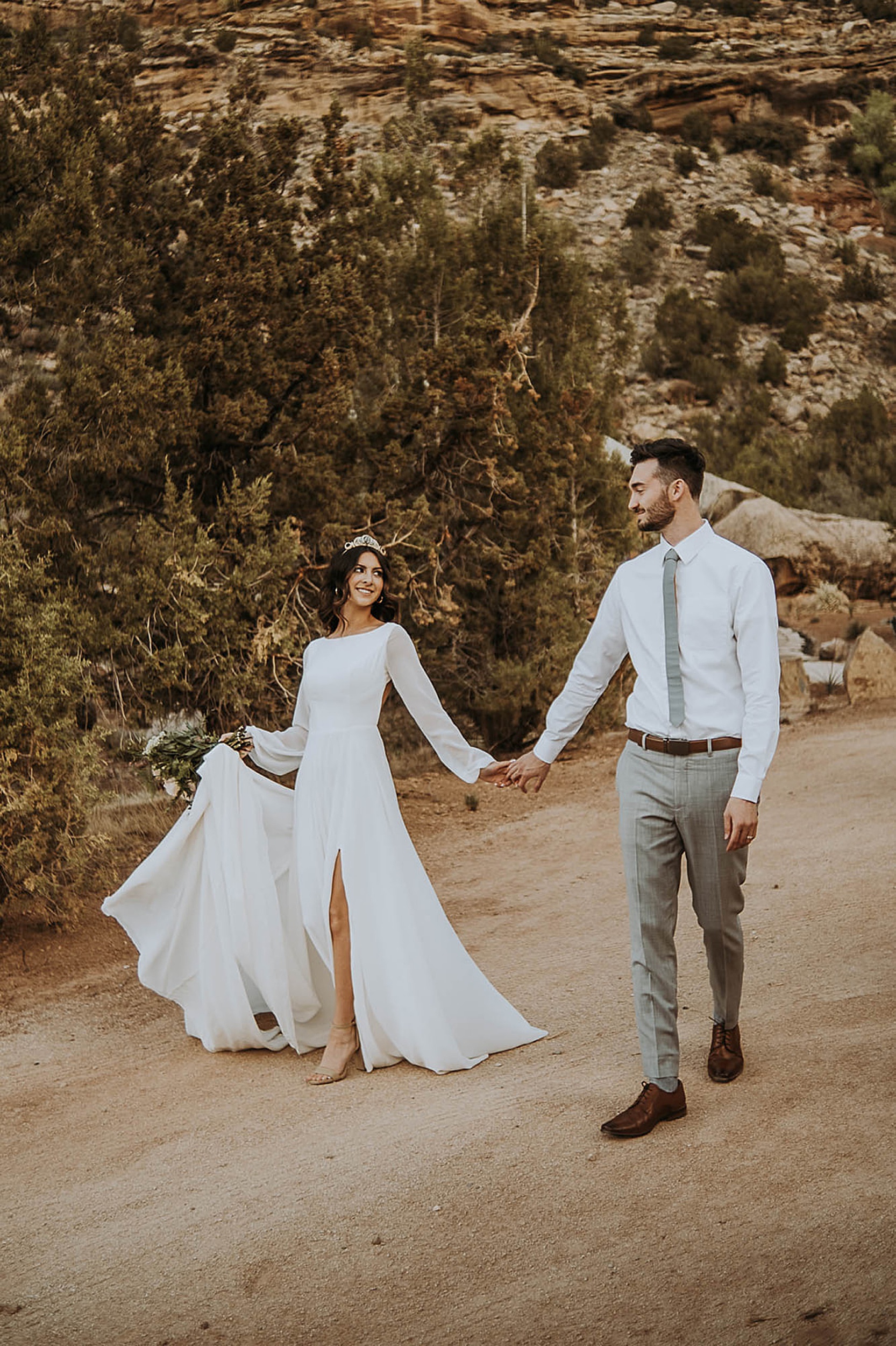 bride and groom walking in Zion