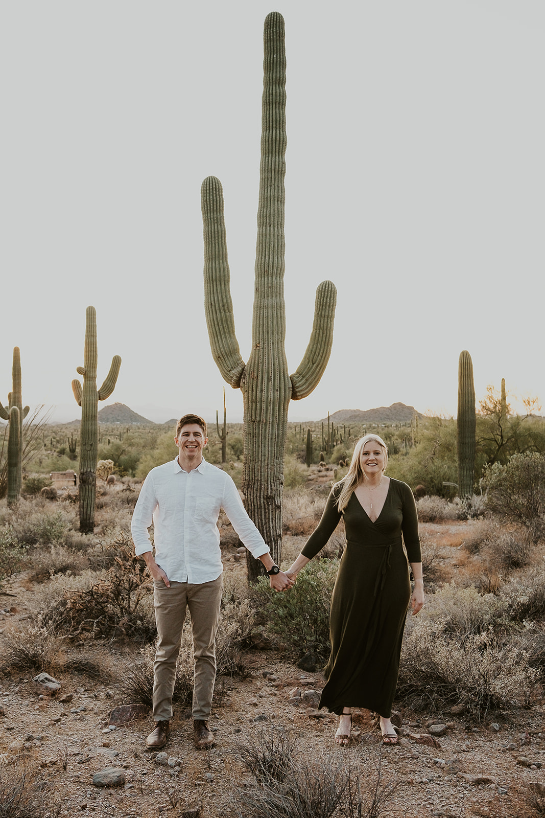 Man and Woman holding hands in Arizona Desert