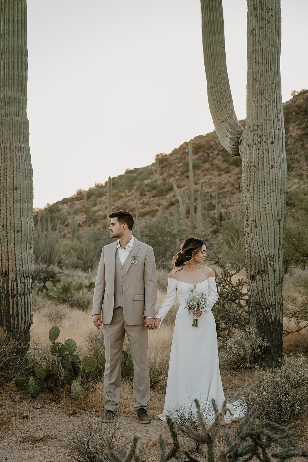 Man and Woman holding hands in Saguaro National Park