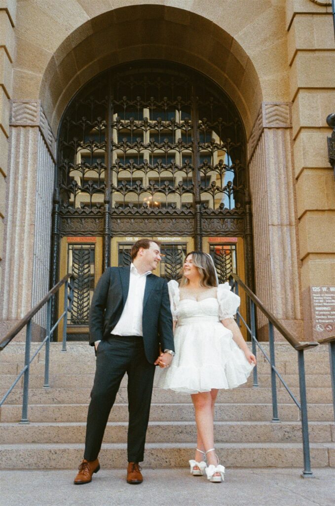Man and women holding hands outside of courthouse Downtown Phoenix