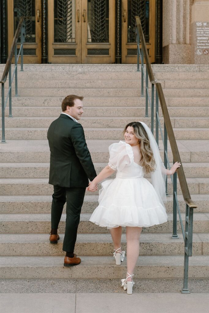Bride and Groom walking up courthouse steps Downtown Phoenix