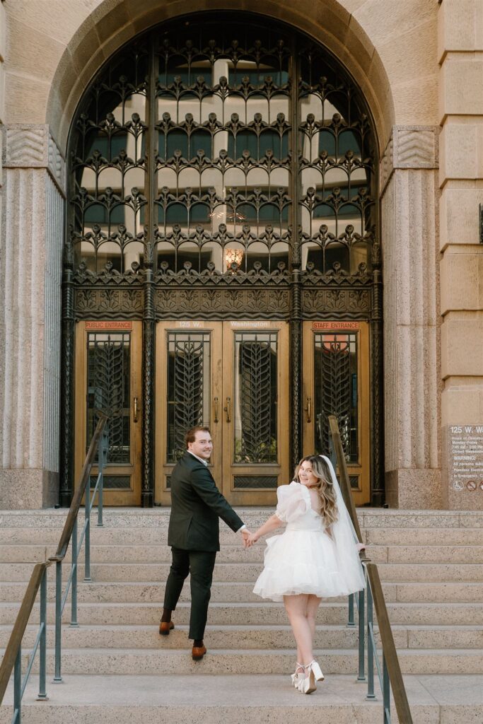 Bride and Groom walking up courthouse steps downtown Phoenix