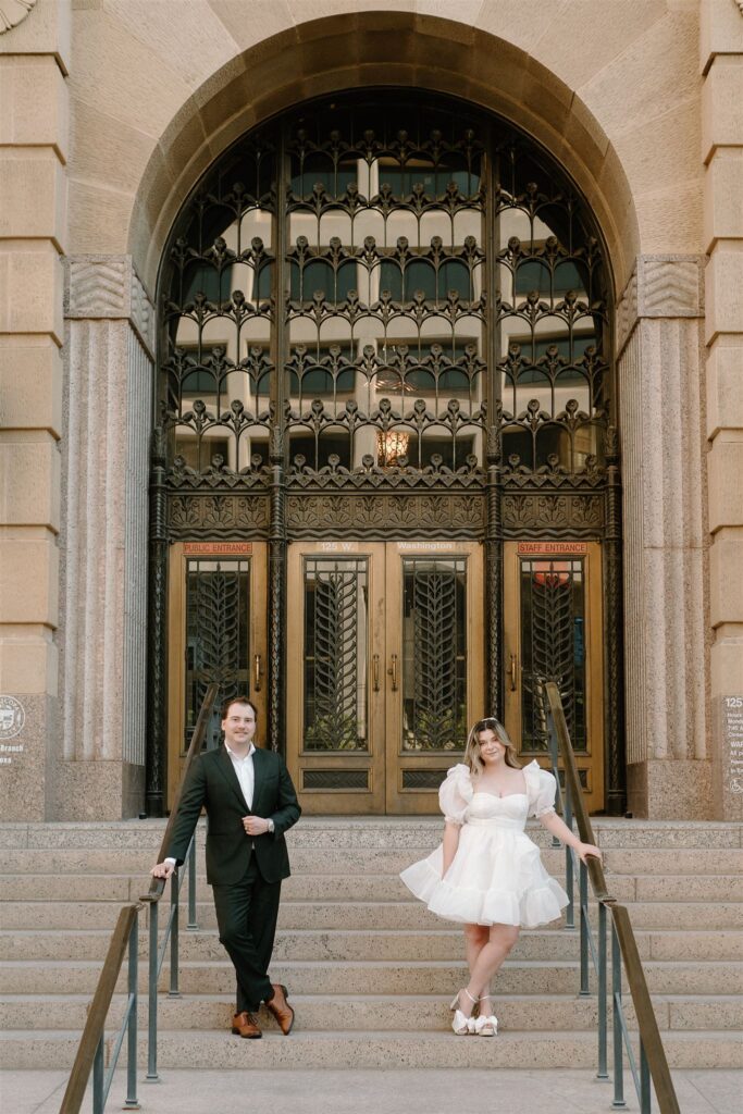 Bride and groom standing on courthouse steps downtown Phoenix