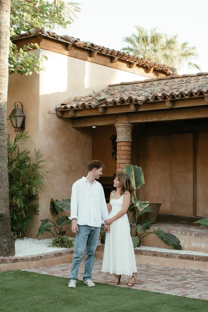 man and women holding hands at the Royal Palms Resort in Scottsdale