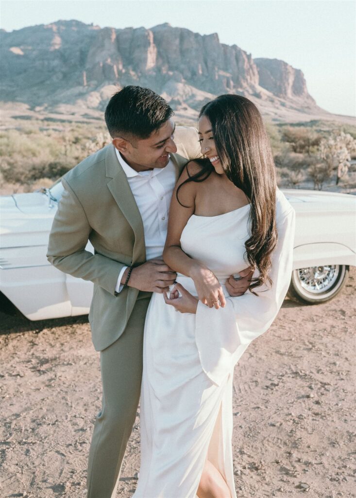 man tickling women in the desert