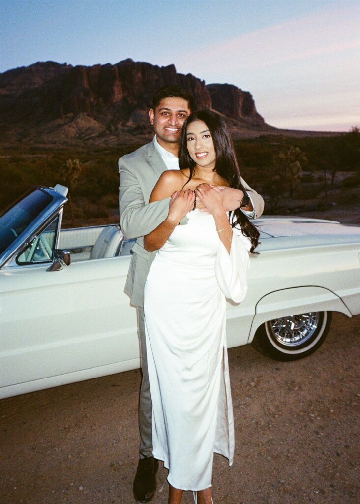 Man holding women in the desert both smiling